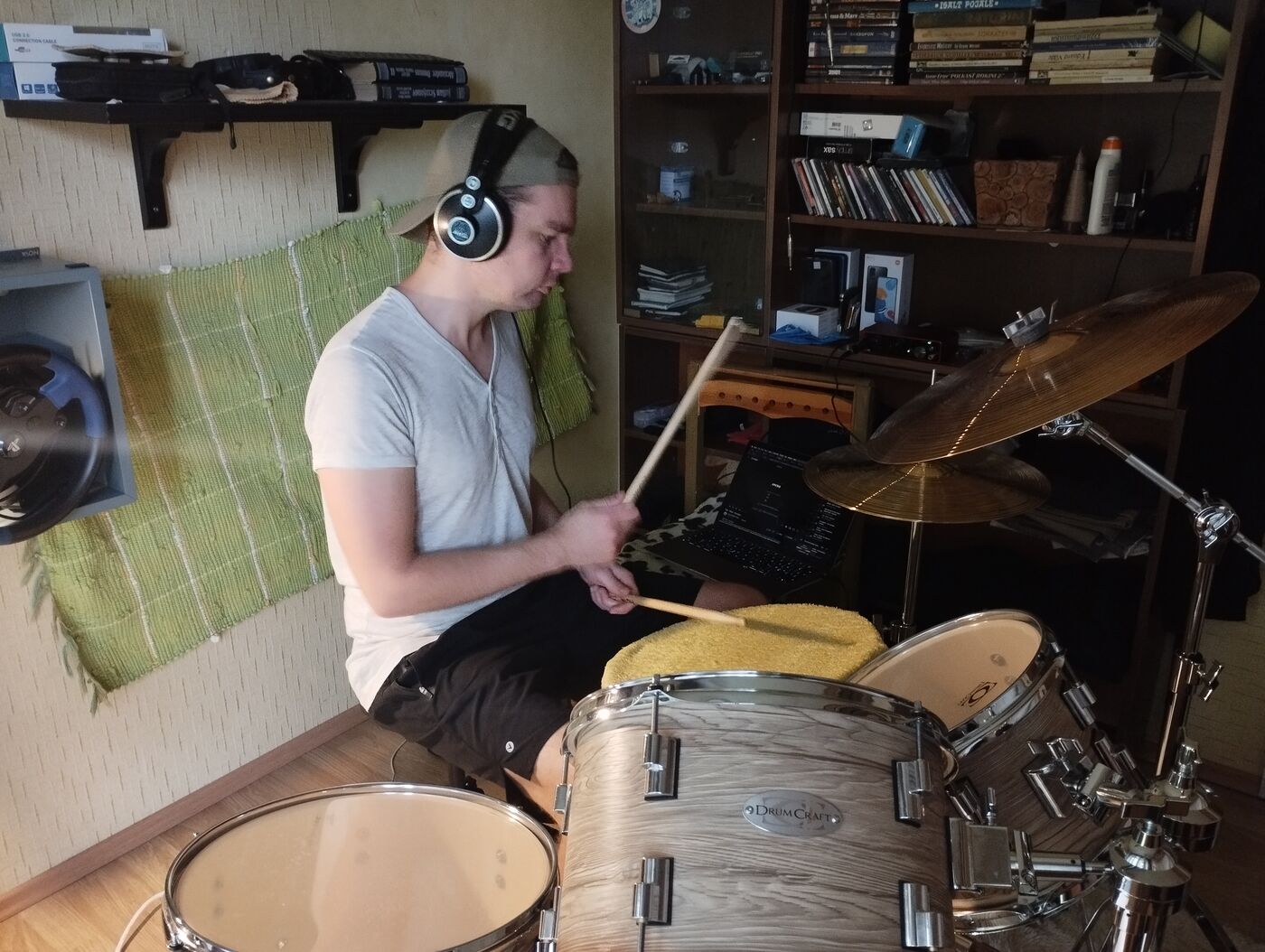 Taavi Toomsalu playing drums in his home studio